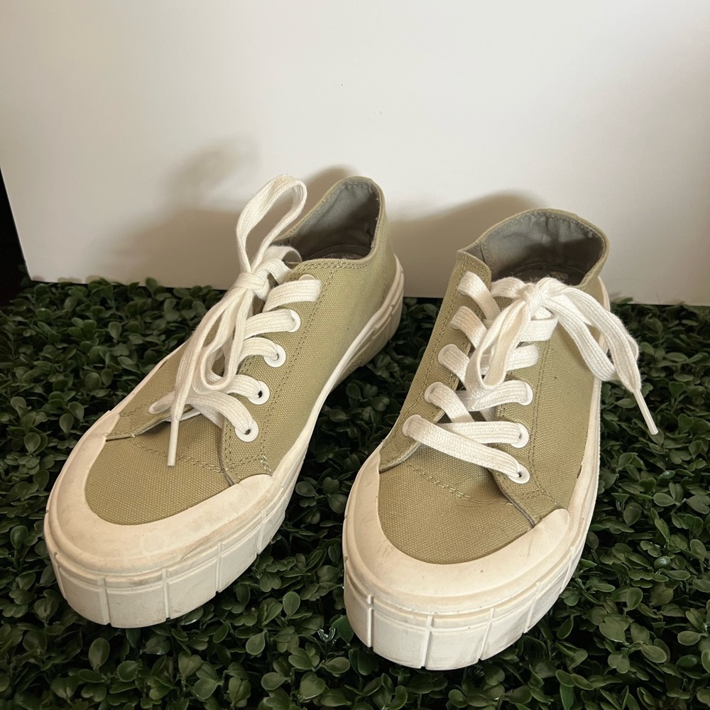 Size 8 green sneakers.